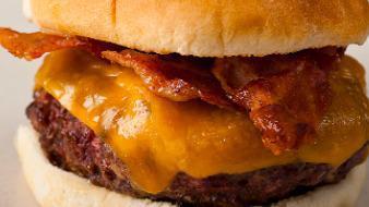 Bacon Cheddar Burger · A 1/4 lb. patty covered with bacon, cheddar cheese, lettuce, and tomato.
