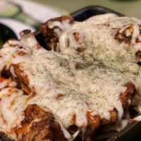 Cheese Baby Back Rib · Hot and spicy grilled baby back rib on a bed of onion and Mozzarella cheese on top.