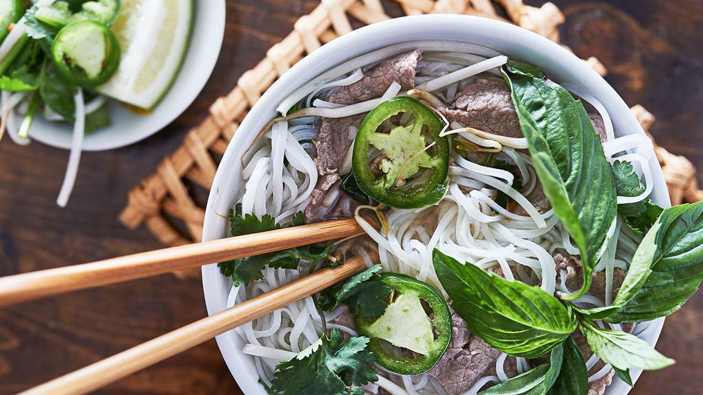 Beef Pho · Richly seasoned Vietnamese-style beef broth ladled over rice noodles and thin slices of tender beef. * 
 
*Popular item.