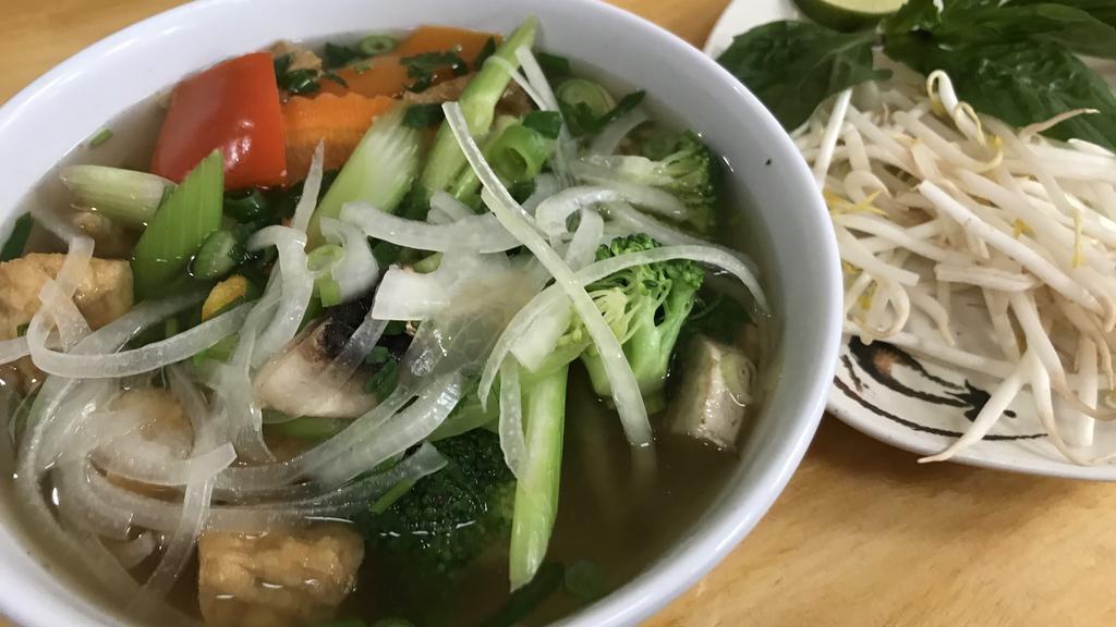 Vegetarian Pho · Popular menu item. Gluten-free. Richly seasoned 100% vegetable stock ladled over rice noodles fresh and fried tofu, vegetables, and mushrooms.