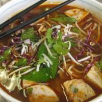 Hue Spicy Beef Noodle Soup · Spicy. Spicy lemongrass beef broth ladled over slow-cooked beef shank, pork ham, and round r...