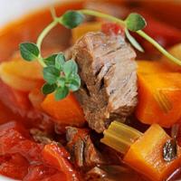 Bo Kho Beef Stew Noodles · Slow-cooked, tender beef brisket, rice noodles, carrots and onions in a savory broth fragran...