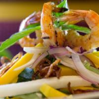 Sweet Mango Salad · Ripe mango slices with grilled shrimp, jicama, red onion, and basil, tossed in tangy lime vi...