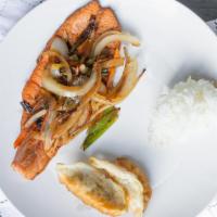 Teriyaki Salmon Bento · Grilled salmon with traditional japanese thick sweet sauce teriyaki. served with soup and sa...