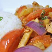 Saltado De Pollo · Chicken sauteed with onions, tomatoes, soy sauce mixed with fries and rice.
