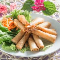 A-9.) Rocket Shrimp Roll / Tom Hoa Tien · Whole shrimps, marinated in special sauce, rolled in egg wrappers and deep fried, served wit...