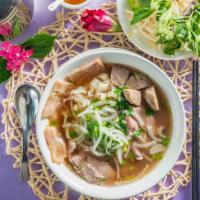 P-30.) Special Combination / Pho Dac Biet · Beef noodle soup with sliced rare beef, well-done brisket, vietnamese. Beef meatballs tendon...