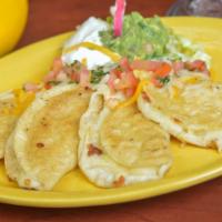 Manchegos · Golden, crispy, corn tortilla quesadillas, filled with Manchego cheese and served with sour ...