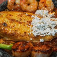 Molcajete Mariscos · Delicious plump scallops, grilled jumbo shrimp and a fillet of Tilapia fish simmered in our ...