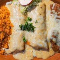Lobster Enchiladas · Delicious lobster pan-fried with fresh garlic, butter and diced onions, rolled in soft corn ...