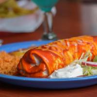 Burrito Chilango · A veggie burro stuffed with bell peppers, onions, refried beans & Veracruz rice, topped with...