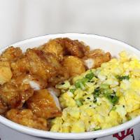 Soy Garlic Chicken Over Rice · Soy Garlic chicken and scrambled eggs, green onion, sauce on steamed rice.