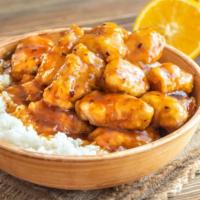 The Orange Chicken Bowl · A bowl of crispy chicken and orange glaze stir-fried and served with white steamed rice.