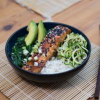 The Teriyaki Salmon Bowl · Delicious, sweet salmon tossed in a tangy teriyaki sauce, served with fresh vegetables and w...
