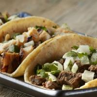 4 Mini Tacos · Four street tacos with one choice of meat, onion, cilantro and guacamole salsa.