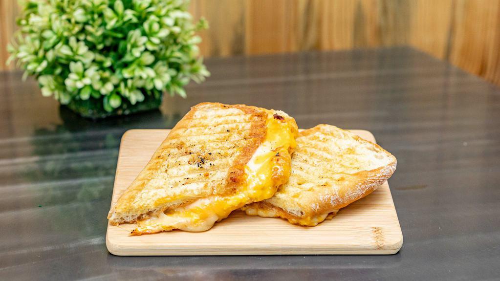 Grilled Cheese Panini · Cheddar Spread, Sharp Cheddar and Provolone. Served on Ciabatta.