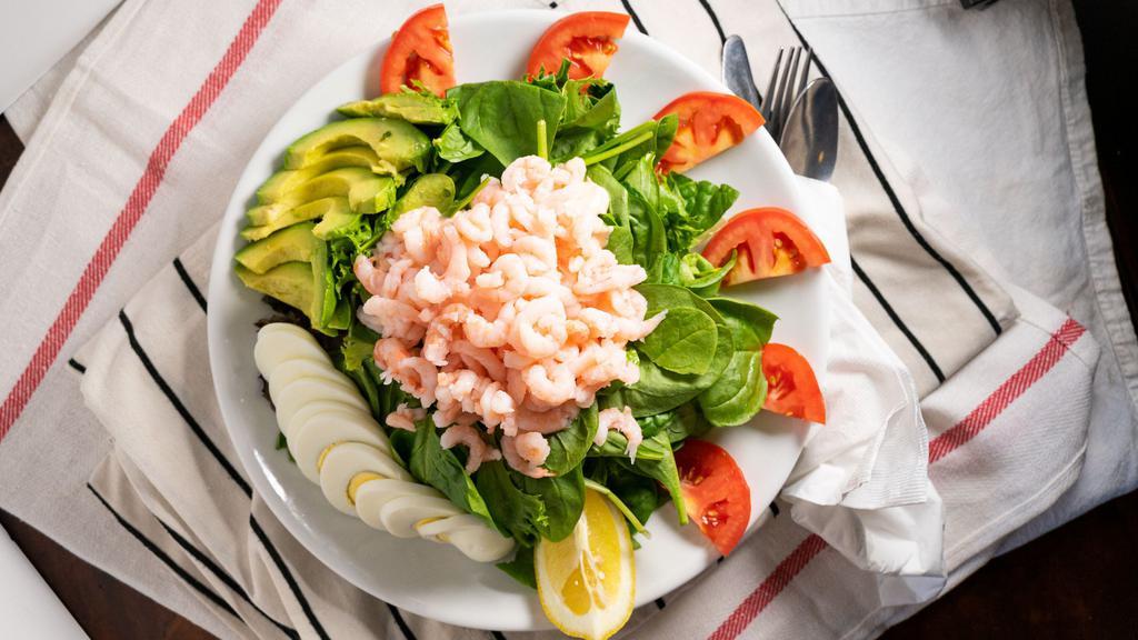 Shrimp Louis Salad · Bay shrimp, mixed greens, avocado, tomato, hard boiled cage-free egg with Thousand Island dressing.