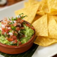 Guacamole And Chips · Housemade guacamole topped with pico de Gallo served with tortilla chips.