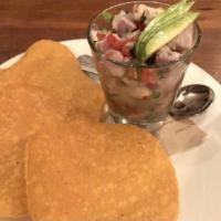 Family Ceviche (Lime Marinated Prawns) · Lime-marinated prawns with pico de gallo and tostadas.