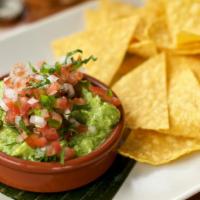 Small Guacamole And Chips · Housemade guacamole topped with pico de gallo served with tortilla chips.