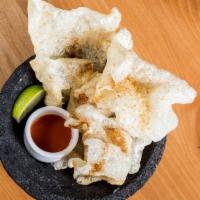 Small Chicharrones · Housemade, crispy fried pork rinds, tossed with chile-lime salt, and served with hot sauce.