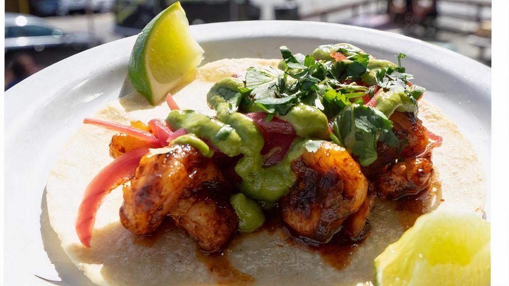 Camarones A La Diabla · Del pacifico wild Mexican shrimp sautéed in a spicy red chile sauce, with pickled red onion, and avocado sauce.