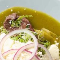 Enchiladas Verdes · Housemade tortillas folded into green tomatillo sauce, topped with queso fresco, lettuce, on...
