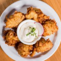 Yucca Root Fritters · Shredded yucca root, masa, and egg dough, fried crispy, and served with Don Froylan Mexican ...