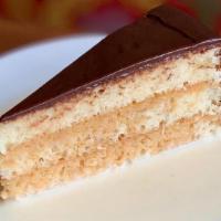 Pastel De Tres Leches · Three layered cake soaked in three milks with seasonal filling and frosting