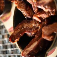Rib Tips App · Meaty portions of seasoned, pecan wood smoked pork rib tips. Served with HopsnDrops special ...