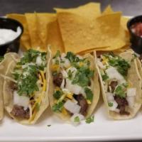 Street Tacos · Classic food truck faire. Tender steak served with cheddar & pepper Jack cheese, onions and ...