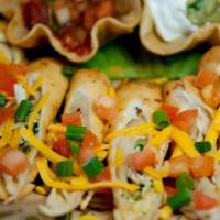 Chicken Taquitos! · Made from scratch. Seasoned chicken, cheddar cheese, diced red onions and cilantro wrapped i...