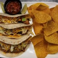 Fish Tacos · That great tempura Alaskan cod served with cheddar, pepper Jack cheese, chipotle salsa, cole...