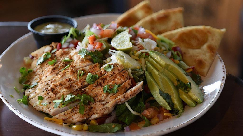 Avocado Chicken Salad · Grilled Cajun chicken breast, cheddar & pepper Jack cheese, Baja veggies, tomato, red pepper, red onion, avocado & fresh cilantro. Served with avocado ranch dressing and a lime wedge.