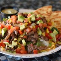 Fajita Steak Salad · Tender steak with mixed greens, cheddar & pepper Jack cheese, caramelized onions, Baja veggi...