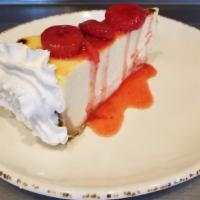 Creamy Ny Style Cheesecake With Fruit · Creamy New York style cheesecake atop a graham cracker crust. Choose your topping of strawbe...