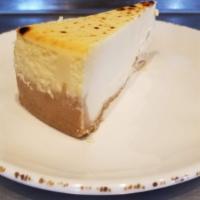 Creamy Ny Style Cheesecake · Creamy New York style cheesecake atop a graham cracker crust.