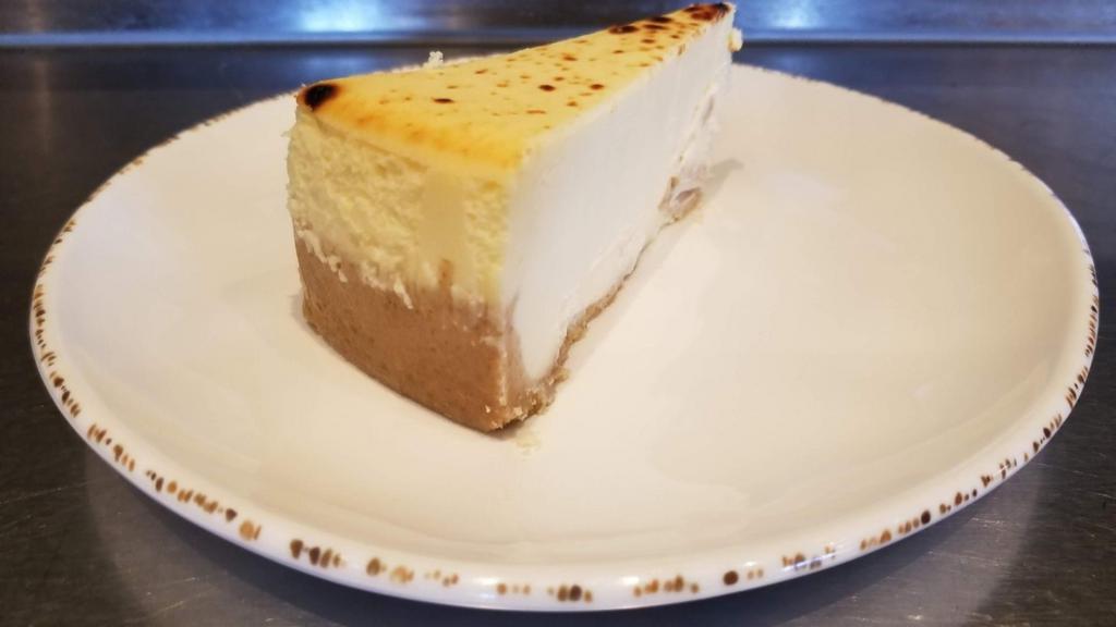 Creamy Ny Style Cheesecake · Creamy New York style cheesecake atop a graham cracker crust.