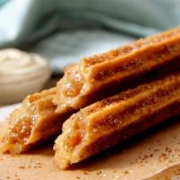 Churro Stick · Our spin on the classic beloved snack, baked to perfection and topped with our world-famous ...