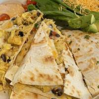 Breakfast Quesadilla · Roasted red pepper, black beans, cheese, egg, chipotle crema.