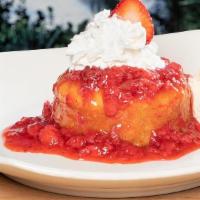Strawberry Buttercake · A warmed rich butter cake, topped with fresh strawberry puree, whipped cream & vanilla ice c...