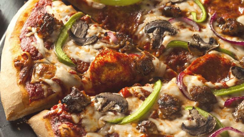Kitchen Sink Pizza · Pepperoni, ham, mushrooms, olives, onion and green pepper.