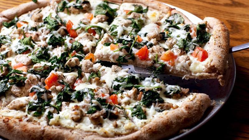 The Florentine Pizza · Secret white sauce with garlic, chopped spinach.