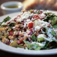 Chicken Chopped Salad · Roasted chicken, salami, onion, tomato, cucumber, and garbanzos with rotini pasta and Romain...