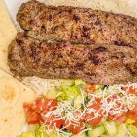 Ground Beef  Souvlaki Plate · Two skewers of marinated lamb served with rice, 1/2 pita bread, and salad.