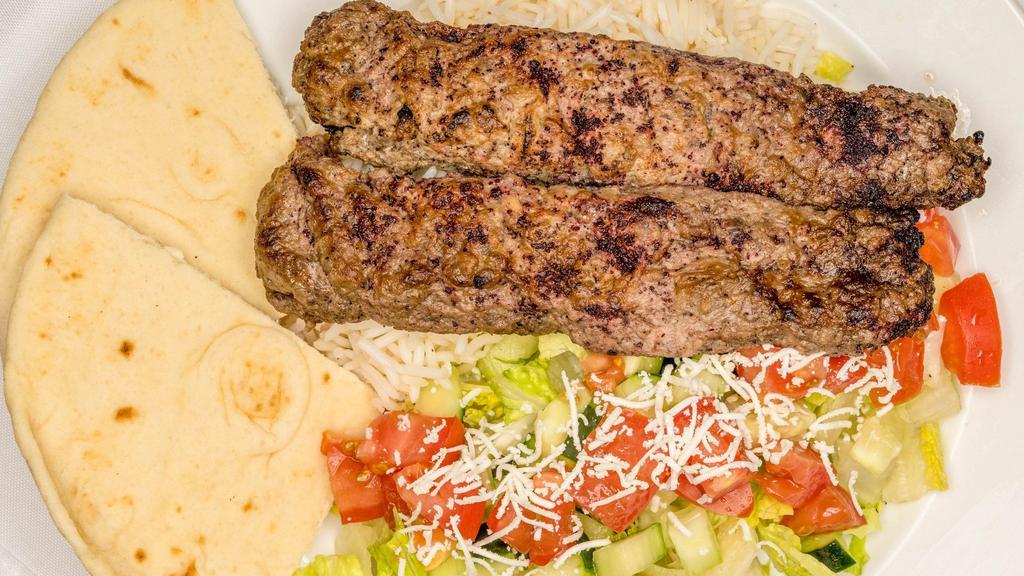 Ground Beef  Souvlaki Plate · Two skewers of marinated lamb served with rice, 1/2 pita bread, and salad.