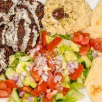 Falafel Plate · Vegetarian. Five pieces of falafel with size salad, hummus, 1/2 pita bread, tahini sauce, an...