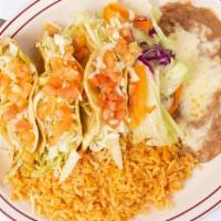 Tacos Carne Asada · Order of three tacos served with rice and beans.