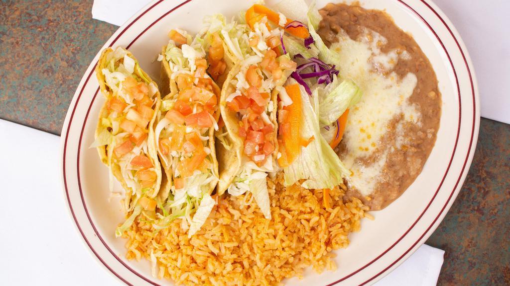 Tacos Carne Asada · Order of three tacos served with rice and beans.