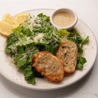 Caesar Salad · Romaine lettuce tossed in Paolo's Caesar dressing, topped with our homemade cheesy, garlic c...